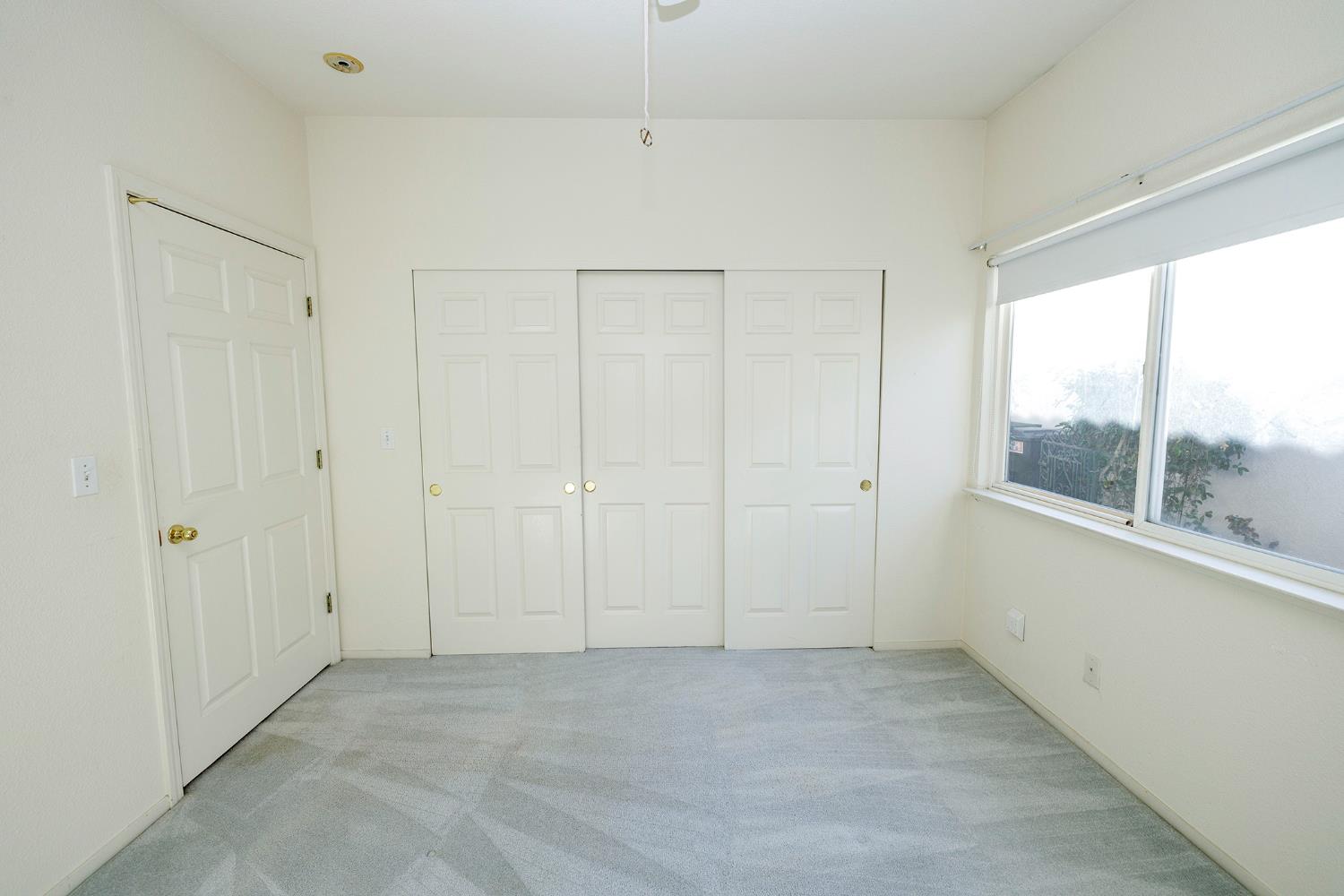 2123 Spring Blossom Lane Turlock, CA 95382 - Photo 19 of 44 a view of an empty room with a window