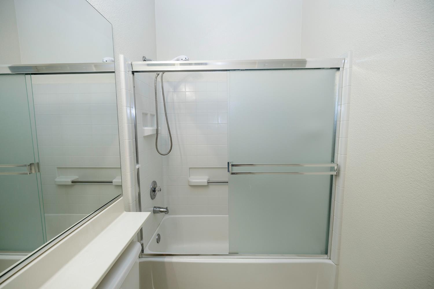 2123 Spring Blossom Lane Turlock, CA 95382 - Photo 22 of 44 a bathroom with a shower and a bath tub