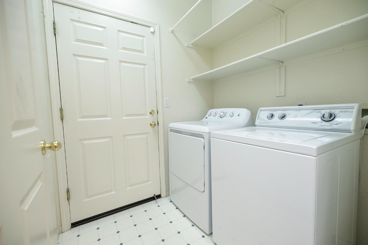 2123 Spring Blossom Lane Turlock, CA 95382 - Photo 23 of 44 a utility room with dryer and washer
