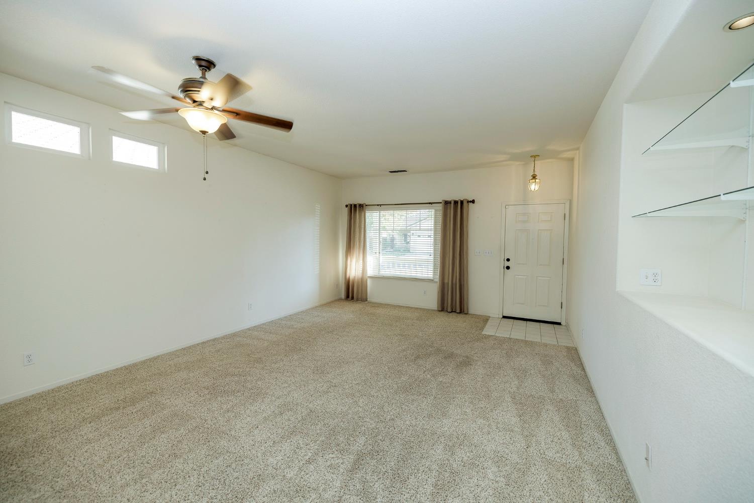 2123 Spring Blossom Lane Turlock, CA 95382 - Photo 6 of 44 a view of an empty room with a window