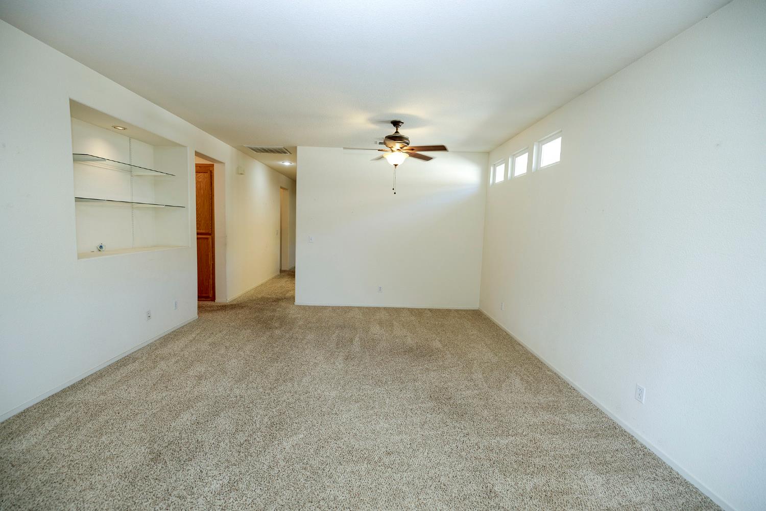 2123 Spring Blossom Lane Turlock, CA 95382 - Photo 8 of 44 an empty room with windows and fan