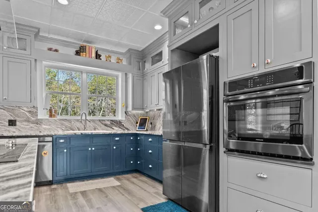 a living room with furniture and a book shelf