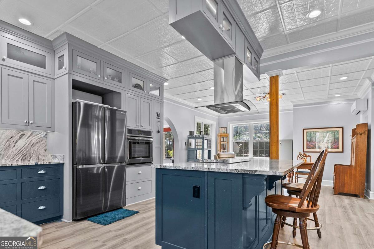 140 Jack Road Fitzgerald, GA 31750 - Photo 17 of 55 a kitchen with stainless steel appliances kitchen island granite countertop a refrigerator and a stove top oven