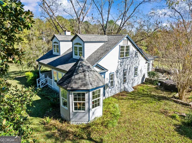 a house with trees in front of it