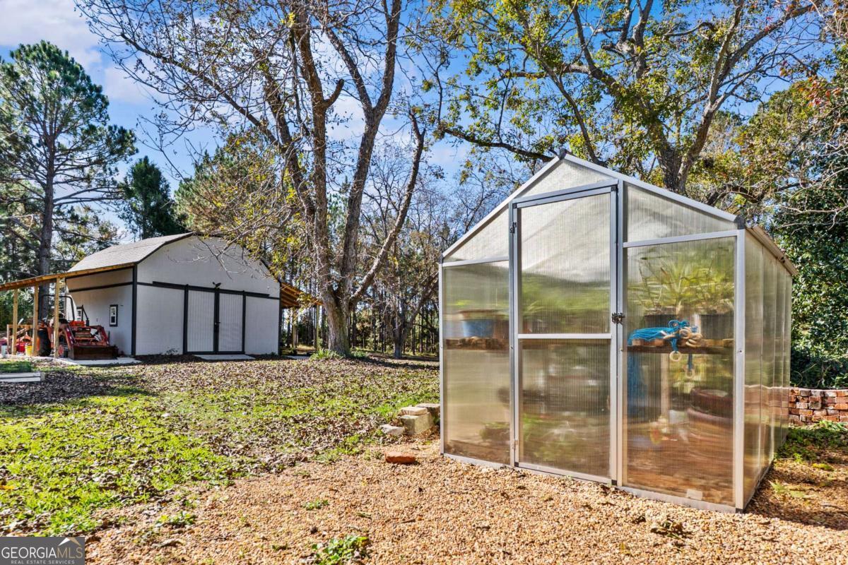 140 Jack Road Fitzgerald, GA 31750 - Photo 46 of 55 a view of a wooden house with a yard