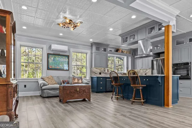 a kitchen with stainless steel appliances granite countertop a sink and cabinets