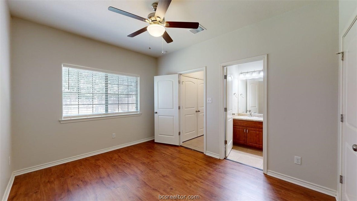 4453-4455 Reveille Road College Station, TX 77845 - Photo 10 of 37 wooden floor in an empty room with a window