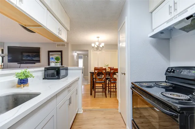 a kitchen with a stove and a sink