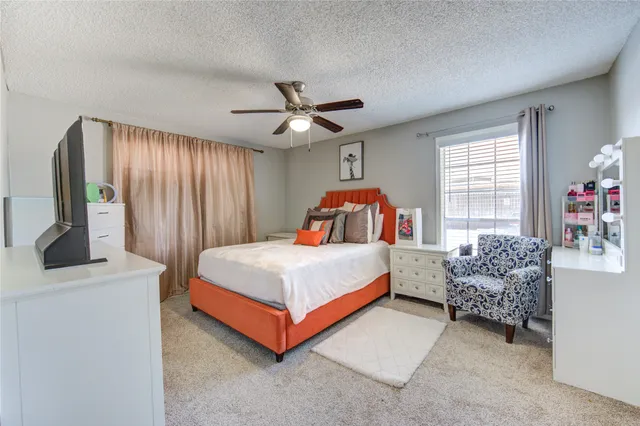 a bed room with a bed and a window