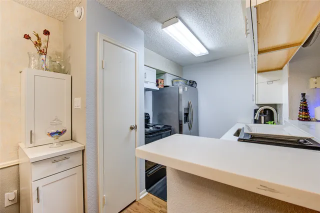 a room with a bed and a dresser