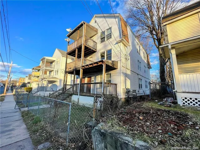 a view of a large building with a yard