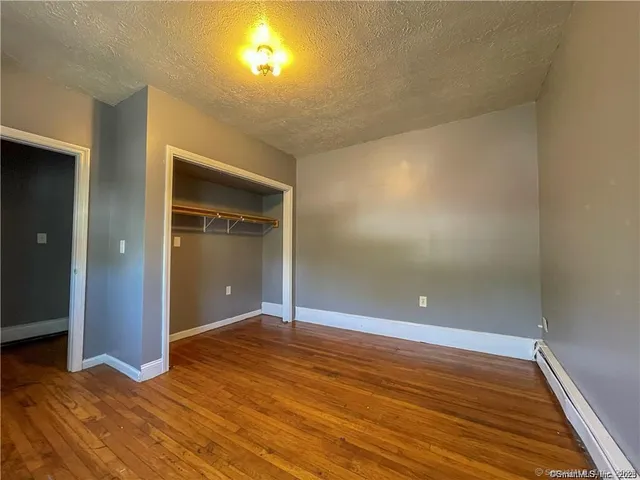 wooden floor in an empty room with a gallery