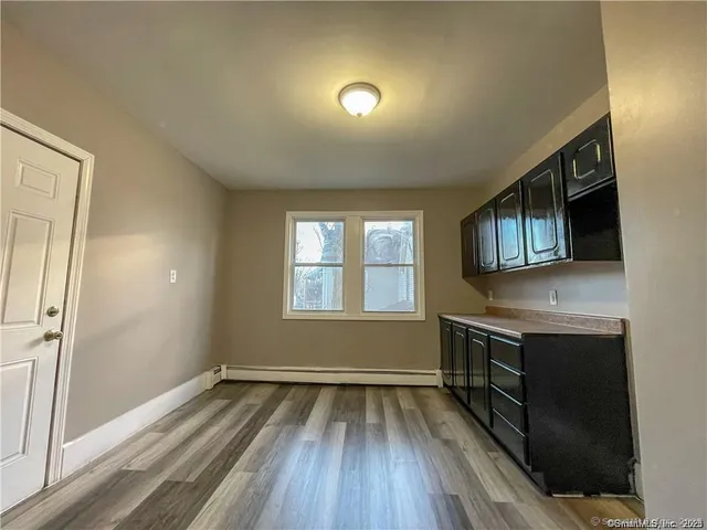 a view of hallway with washer and dryer