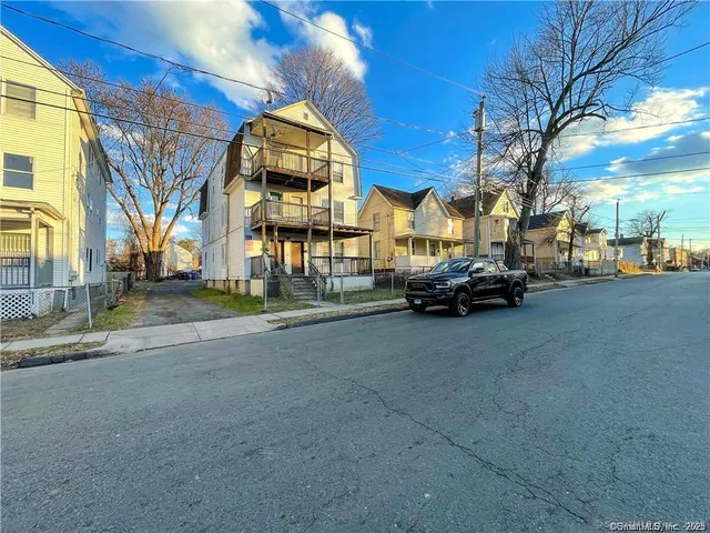 a view of a street with cars