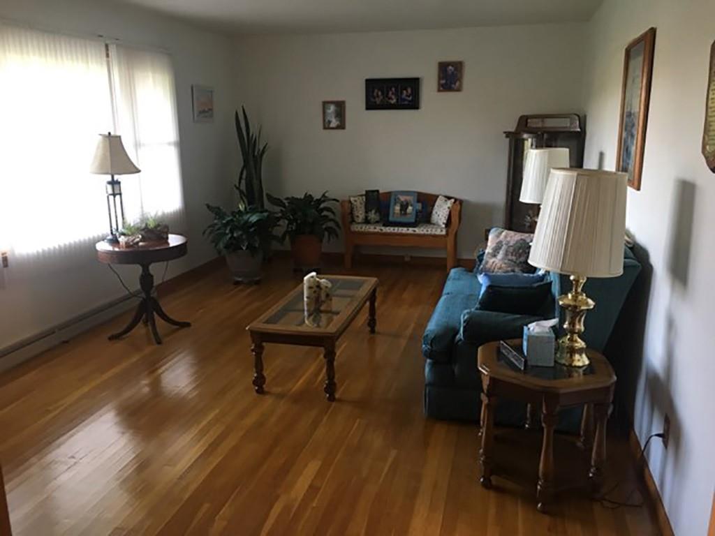 818 Barclay Road Indiana, PA 15701 - Photo 3 of 15 a living room with furniture wooden floor and a lamp