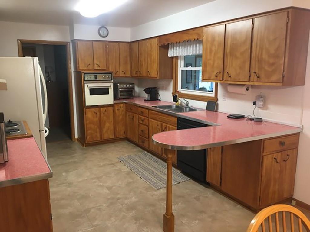 818 Barclay Road Indiana, PA 15701 - Photo 5 of 15 a kitchen with a sink refrigerator and cabinets