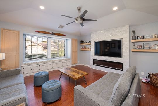 223 West Cobblestone Lane Ridgecrest, CA 93555 - Photo 2 of 34 a living room with furniture and a flat screen tv