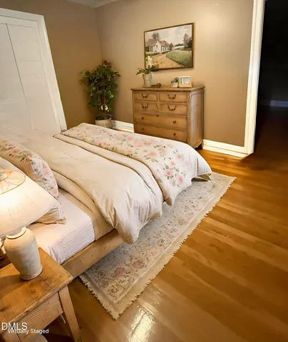 a bedroom with a bed and a dresser