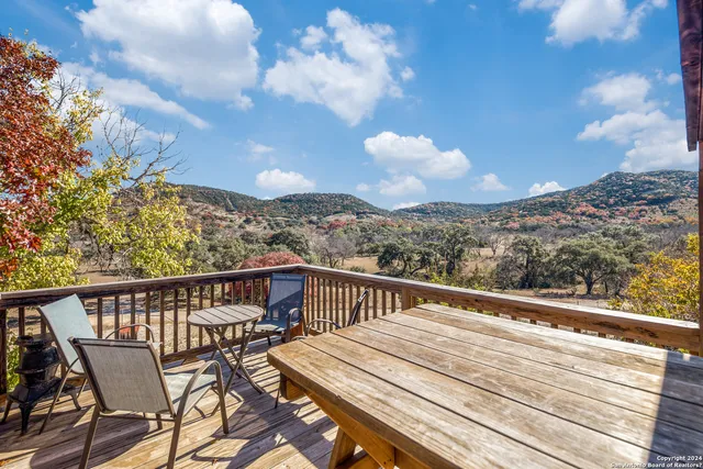 a view of a balcony with wooden floor