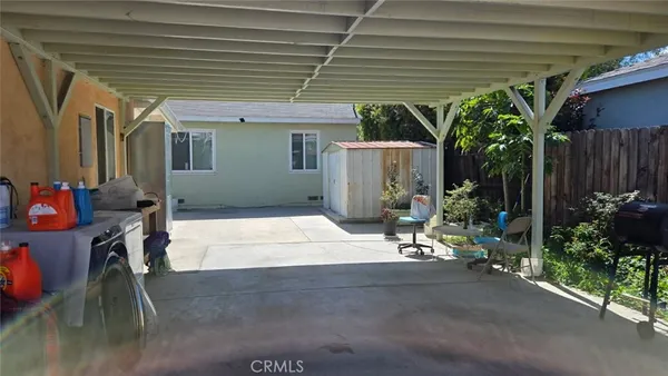 a house with potted plants in front of it