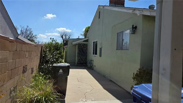 a potted plant sitting in front of a house