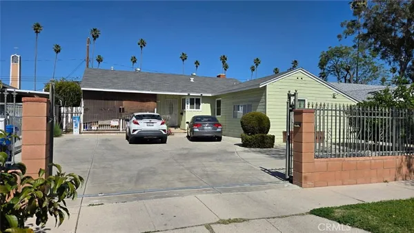 a view of a car parked in front of house
