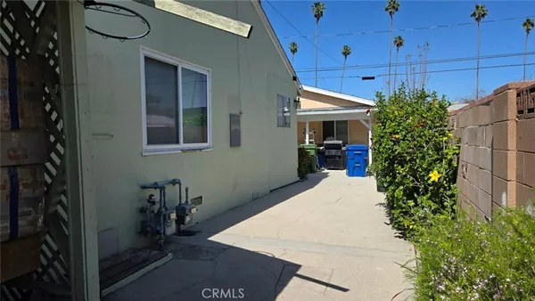 a view of a house with a potted plant
