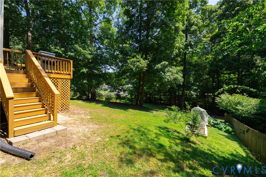 4501 Foxwood Road Chester, VA 23831 - Photo 29 of 42 Elevated wood deck with lattice skirting, wood rai