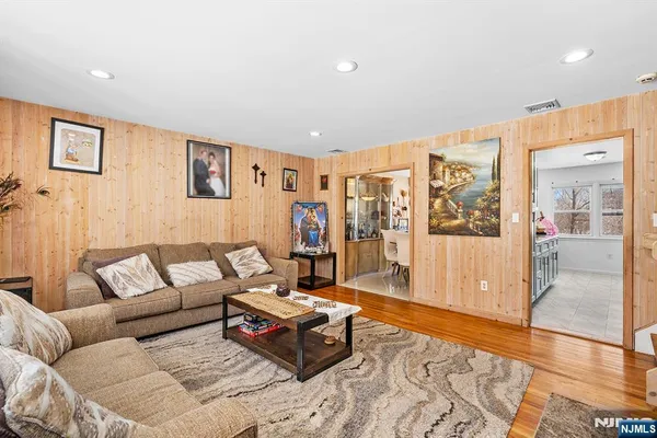 a living room with furniture and large window