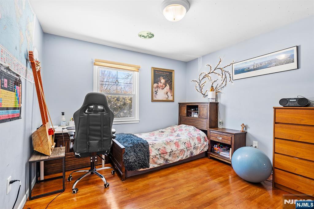 406 Kinderkamack Road River Edge, NJ 07661 - Photo 10 of 18 a bedroom with furniture and a wooden floor