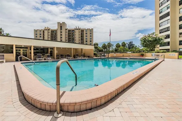 a view of swimming pool with seating space