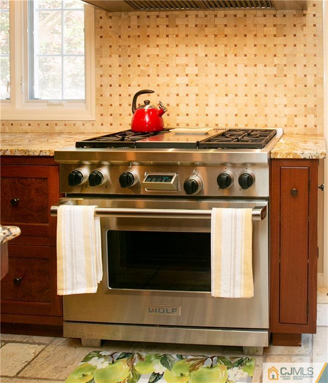 36 Pine Ridge Drive Edison, NJ 08820 - Photo 15 of 51 a stove top oven sitting inside of a kitchen