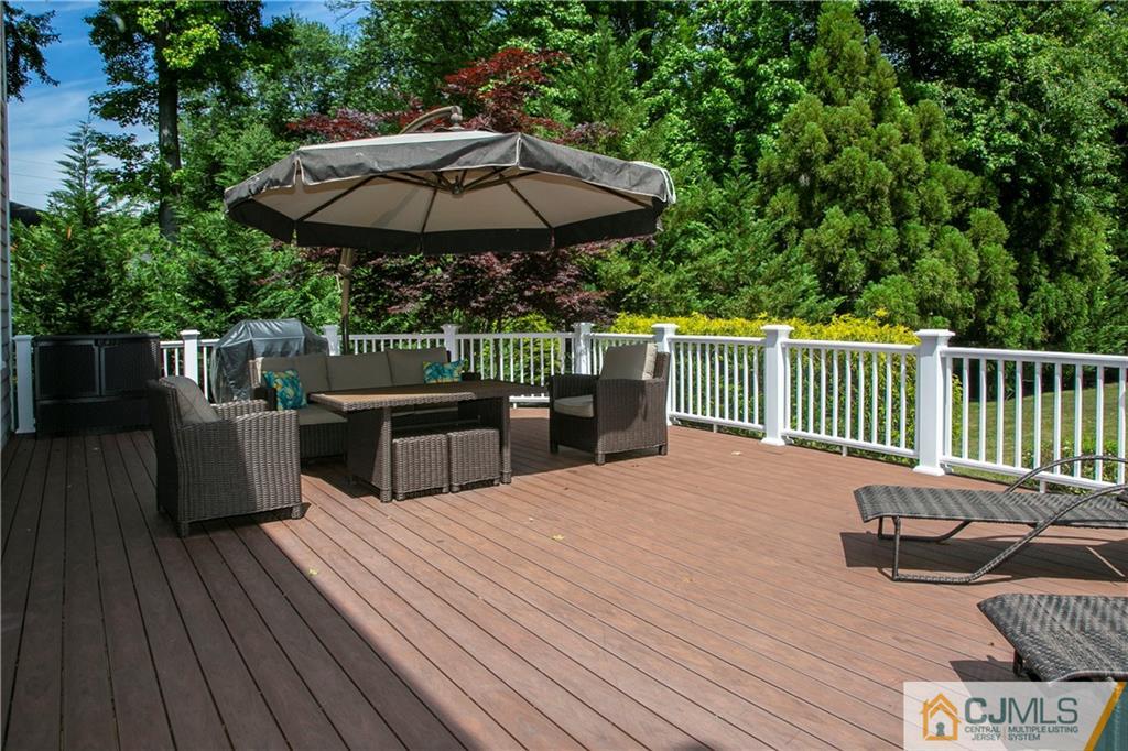 36 Pine Ridge Drive Edison, NJ 08820 - Photo 39 of 51 a view of a chairs and table on the wooden floor