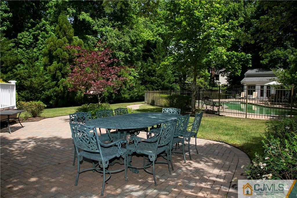 36 Pine Ridge Drive Edison, NJ 08820 - Photo 41 of 51 a view of a table and chairs in backyard of the house