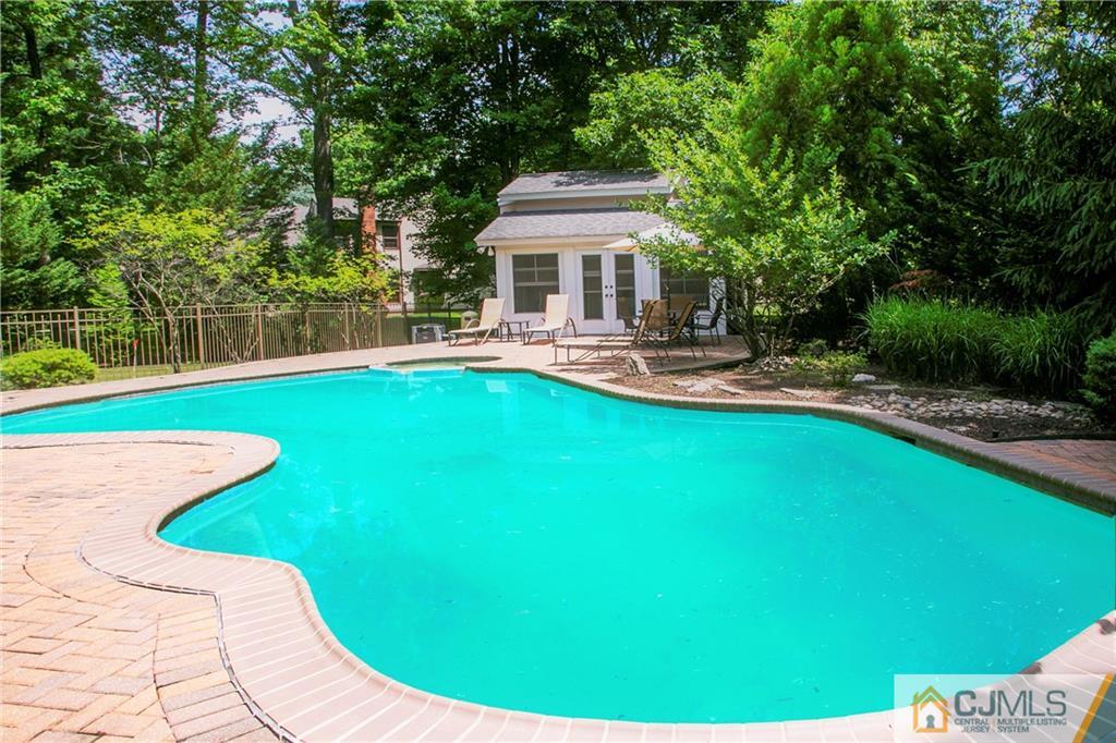 36 Pine Ridge Drive Edison, NJ 08820 - Photo 43 of 51 a swimming pool with outdoor seating and yard
