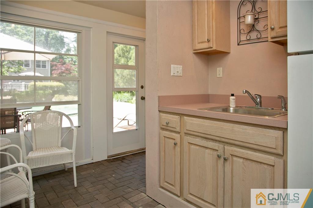 36 Pine Ridge Drive Edison, NJ 08820 - Photo 47 of 51 a bathroom with a sink and a mirror
