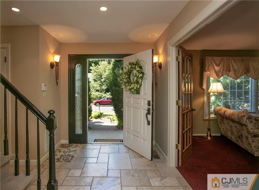 36 Pine Ridge Drive Edison, NJ 08820 - Photo 5 of 51 a view of an entryway door and an living room