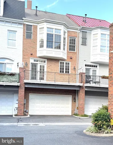 a view of a pathway with a garden