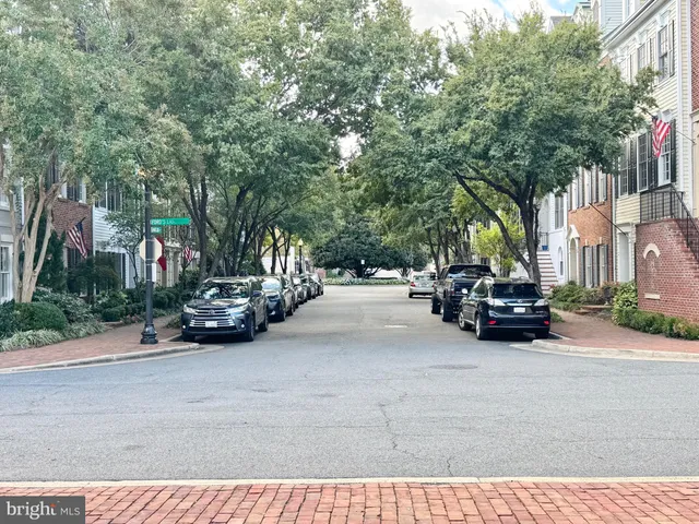 a view of a terrace with couches and wooden fence