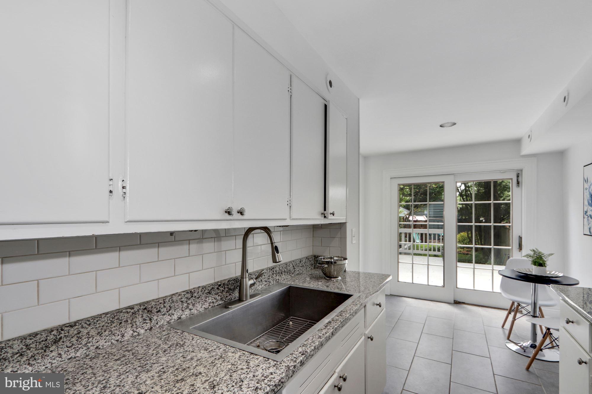 3212 Klingle Road Northwest Washington, DC 20008 - Photo 14 of 35 Subway Tile Backsplash and Granite Countertops