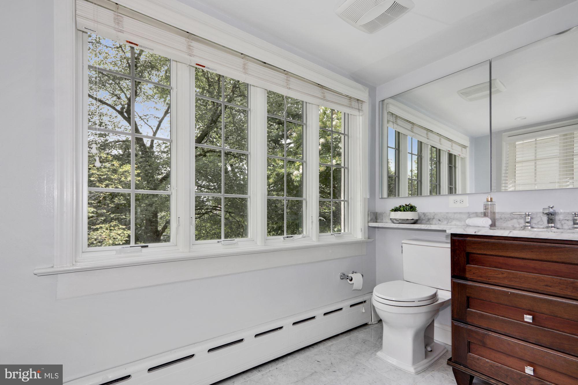 3212 Klingle Road Northwest Washington, DC 20008 - Photo 18 of 35 Primary Bathroom with Natural Light