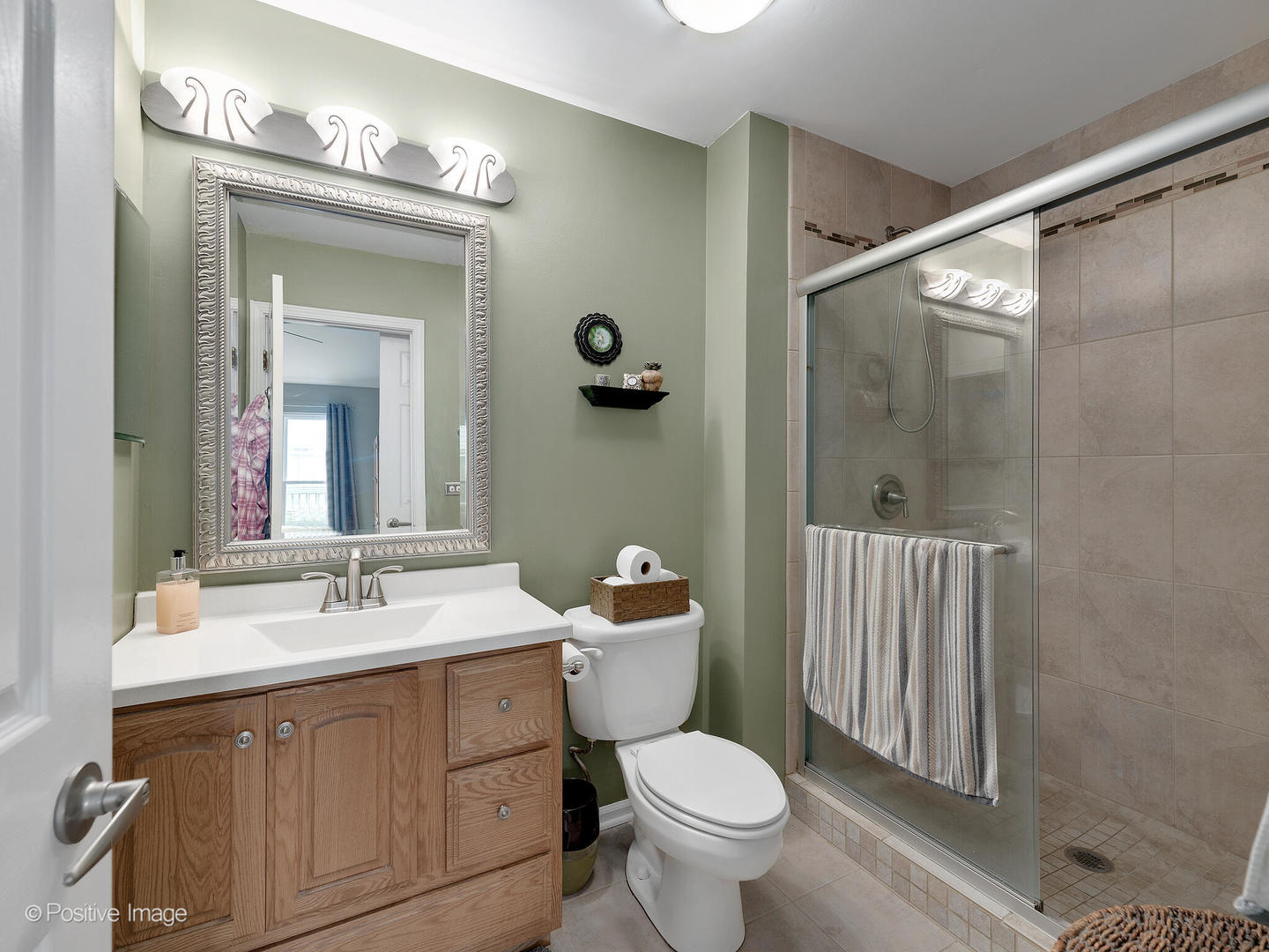 1334 Ridgefield Circle Carol Stream, IL 60188 - Photo 11 of 16 a bathroom with a sink toilet and shower