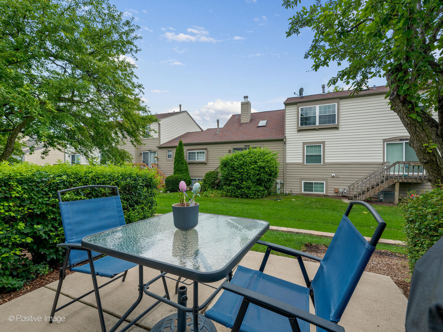 1334 Ridgefield Circle Carol Stream, IL 60188 - Photo 14 of 16 a view of a patio with table and chairs and potted plants with wooden floor and fence