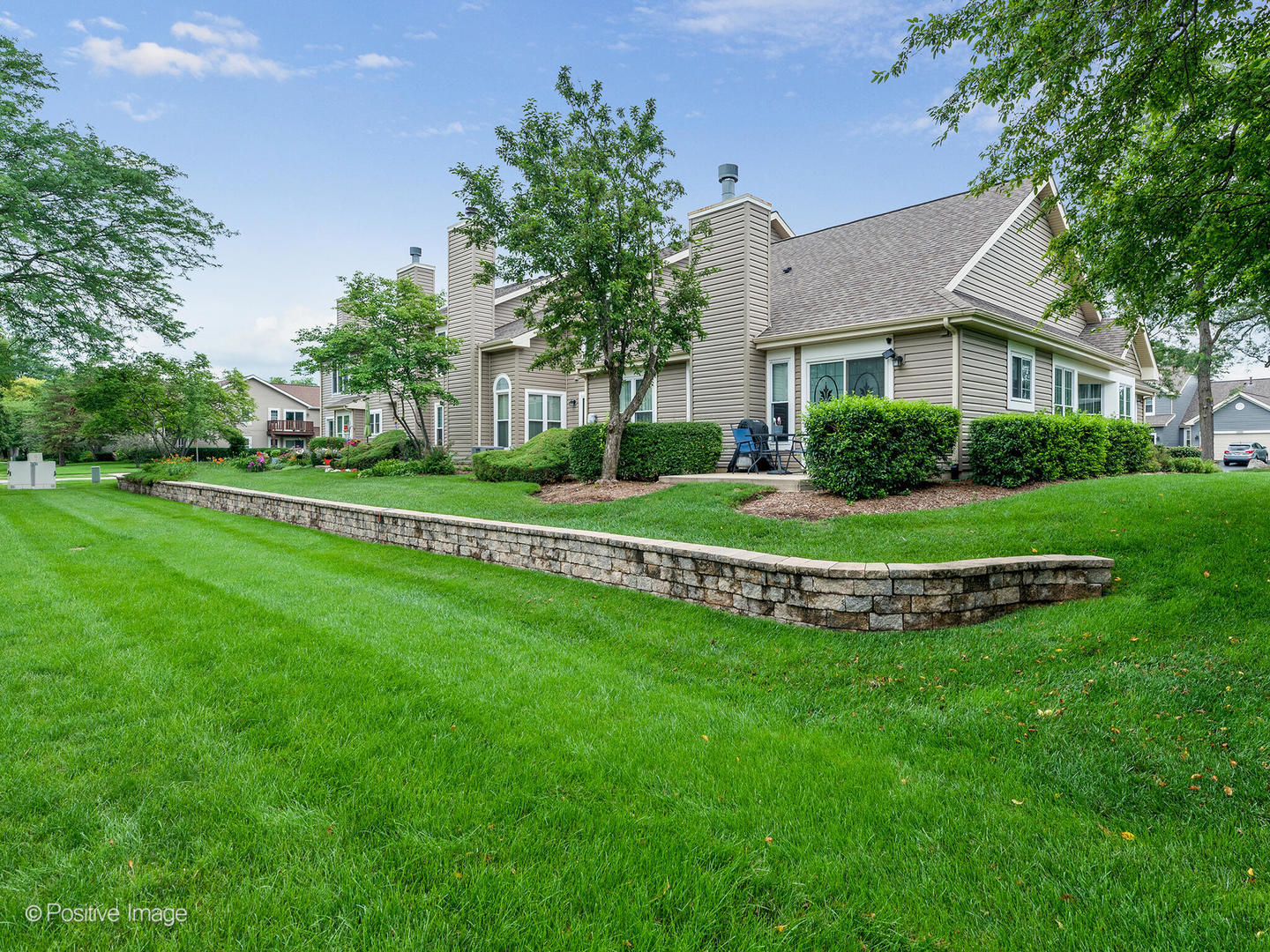 1334 Ridgefield Circle Carol Stream, IL 60188 - Photo 15 of 16 a view of a house with a big yard and potted plants and large trees