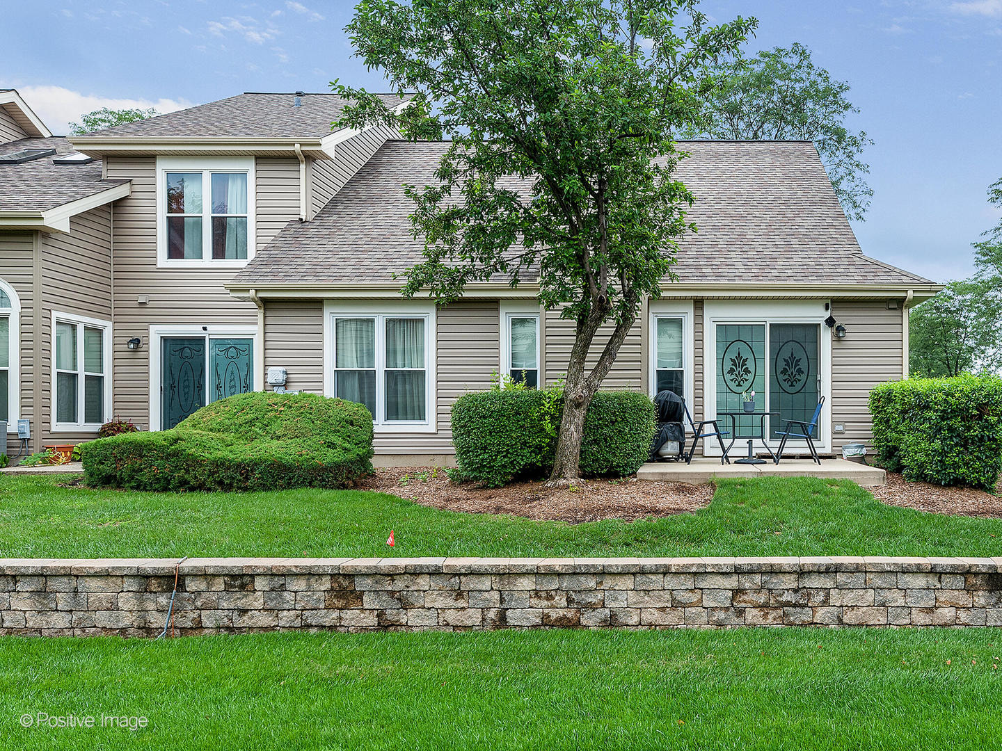 1334 Ridgefield Circle Carol Stream, IL 60188 - Photo 16 of 16 a front view of a house with a yard