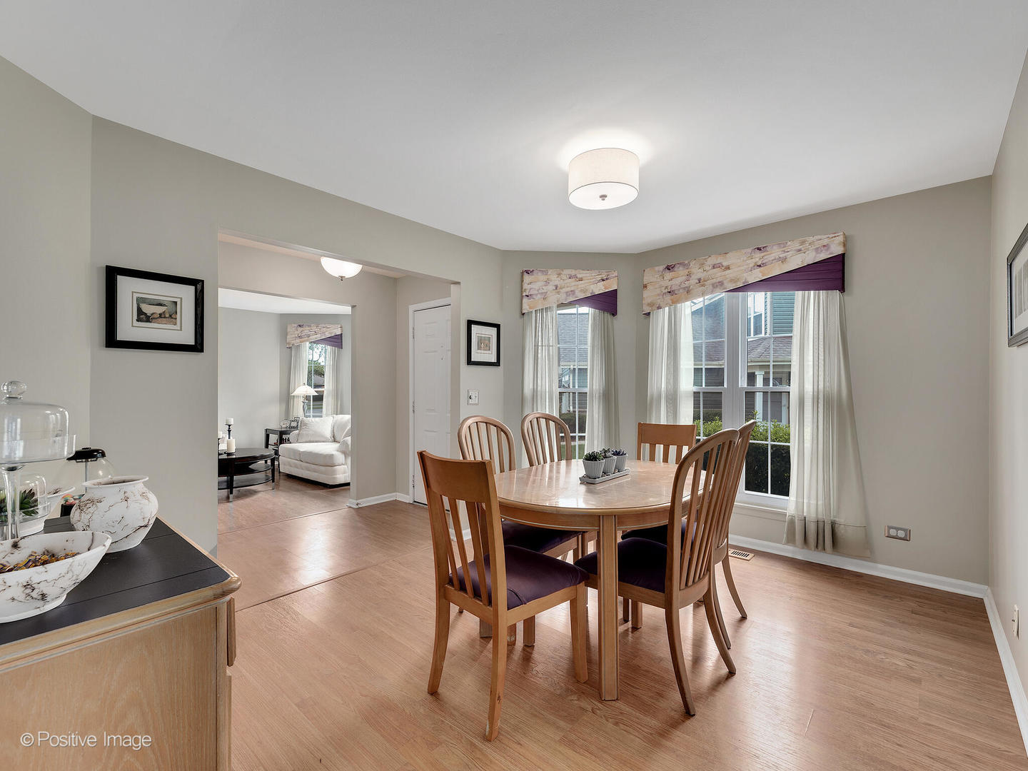 1334 Ridgefield Circle Carol Stream, IL 60188 - Photo 5 of 16 a view of a dining room with furniture and wooden floor
