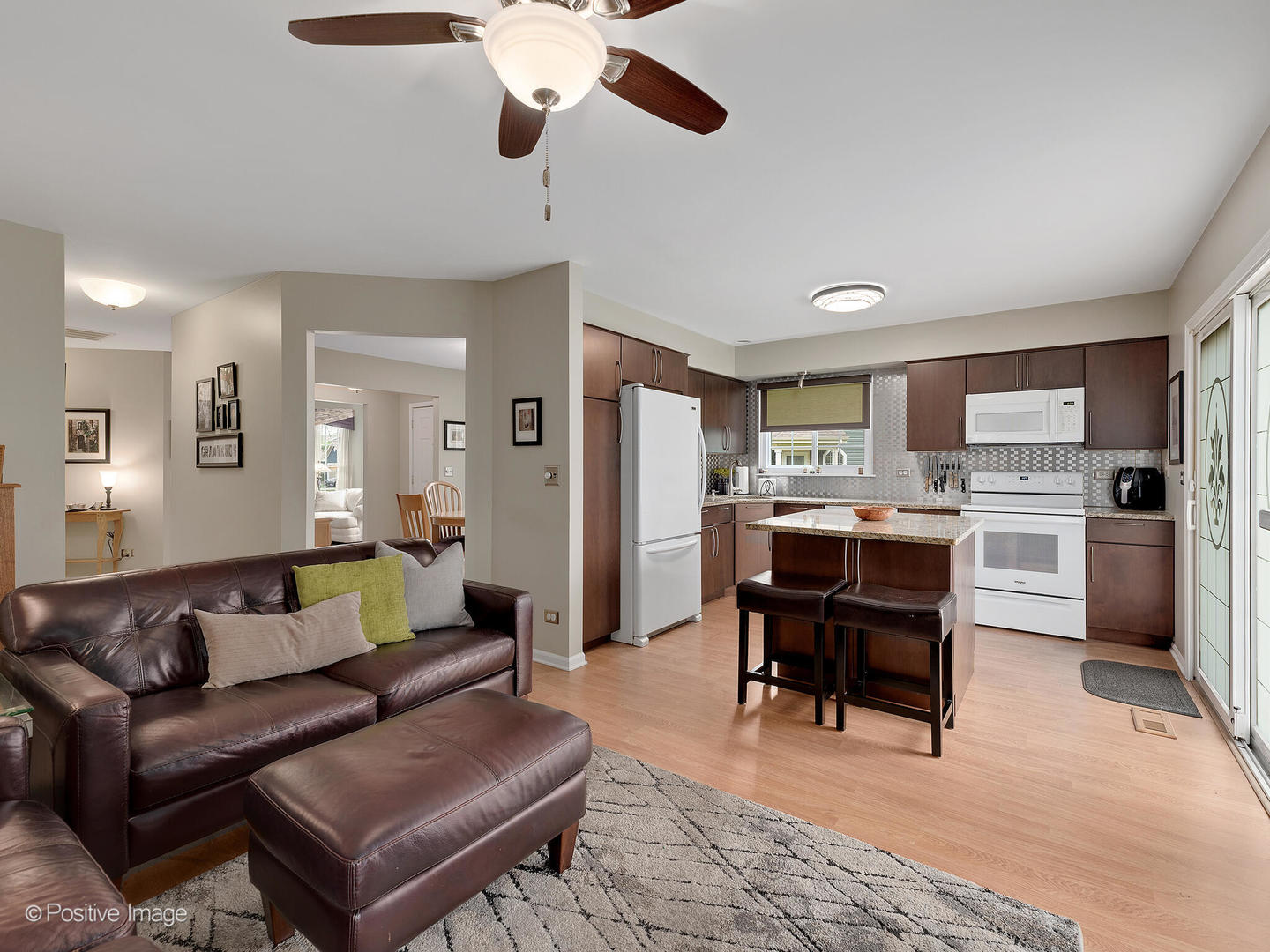 1334 Ridgefield Circle Carol Stream, IL 60188 - Photo 7 of 16 a living room with furniture a dining table and kitchen view