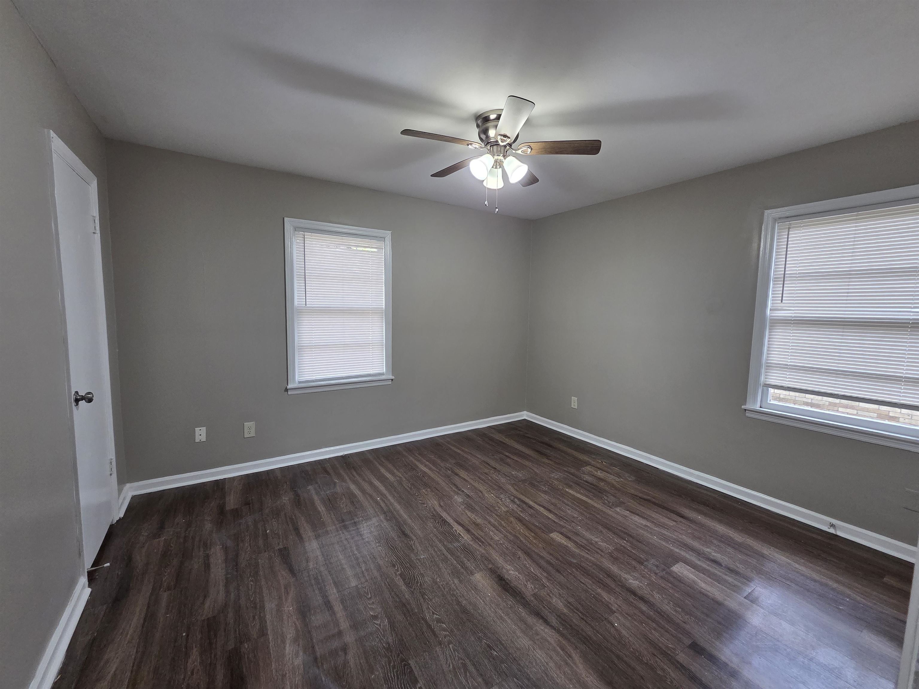 3602 Gowan Drive Memphis, TN 38127 - Photo 11 of 20 a view of an empty room with wooden floor and a window