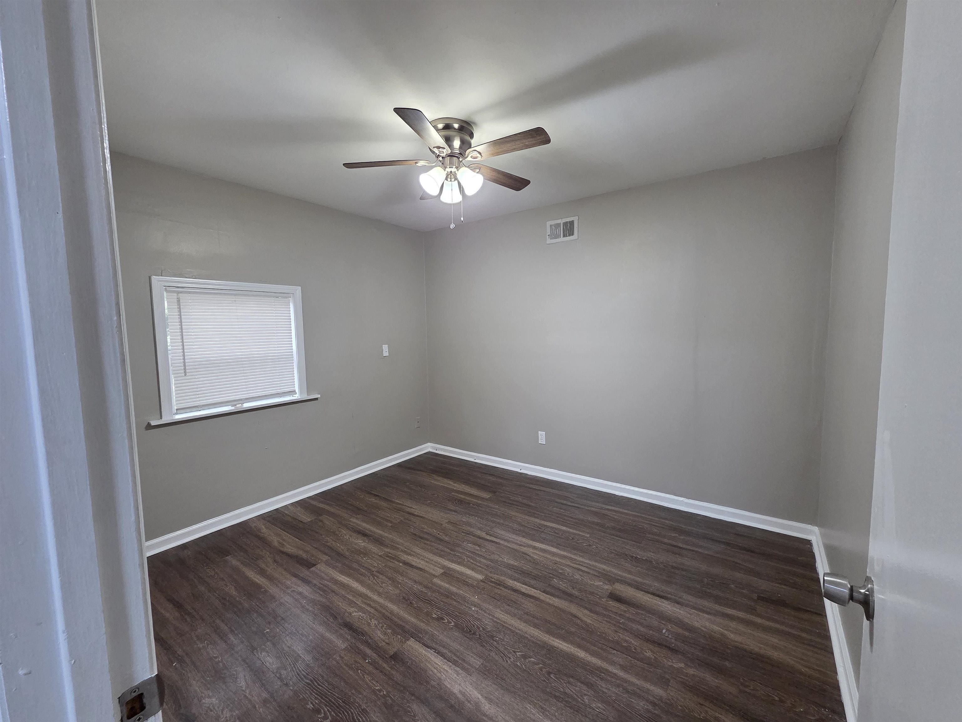 3602 Gowan Drive Memphis, TN 38127 - Photo 8 of 20 a view of an empty room with wooden floor