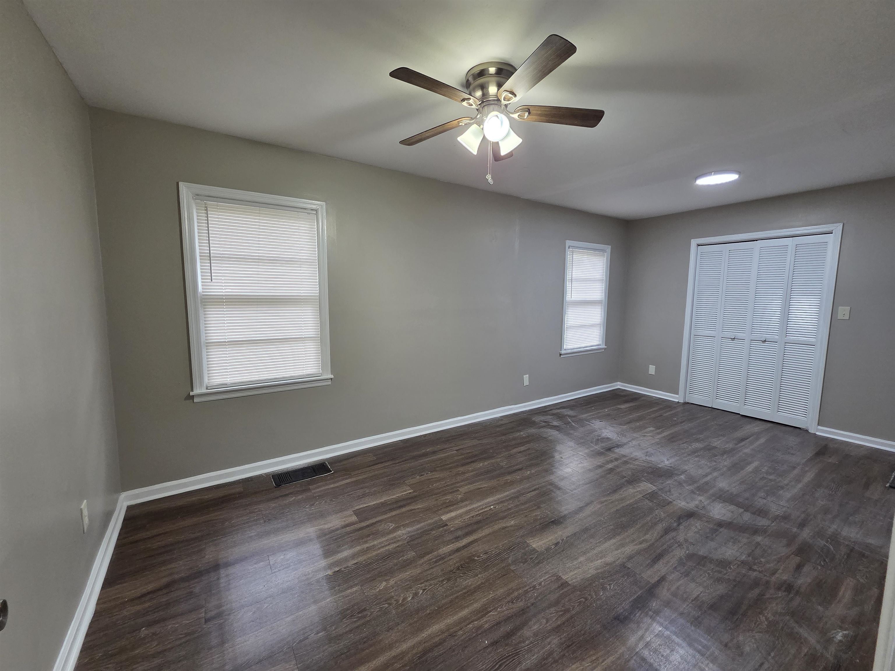 3602 Gowan Drive Memphis, TN 38127 - Photo 10 of 20 a view of an empty room with a window and wooden floor